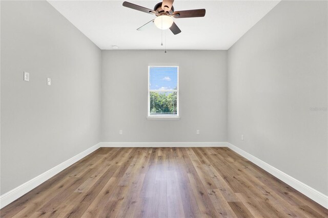 spare room with ceiling fan and hardwood / wood-style floors