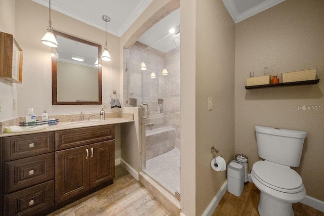 bathroom with a shower with door, vanity, toilet, hardwood / wood-style flooring, and crown molding