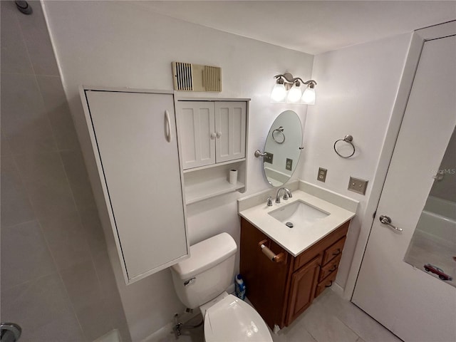 bathroom with toilet, tile patterned floors, and vanity