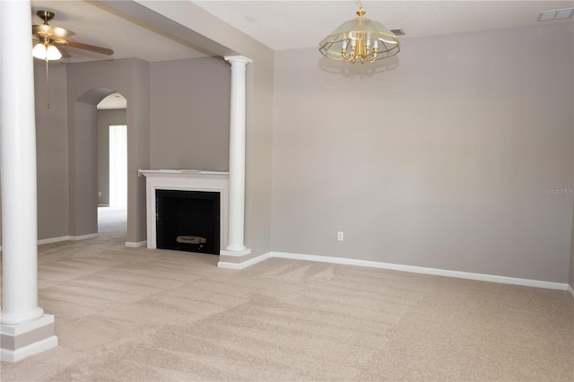 unfurnished living room featuring light carpet and ceiling fan with notable chandelier