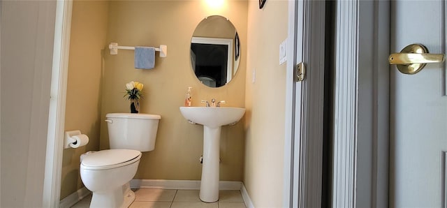 bathroom featuring toilet and tile patterned floors