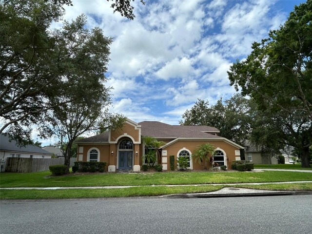 ranch-style house with a front yard