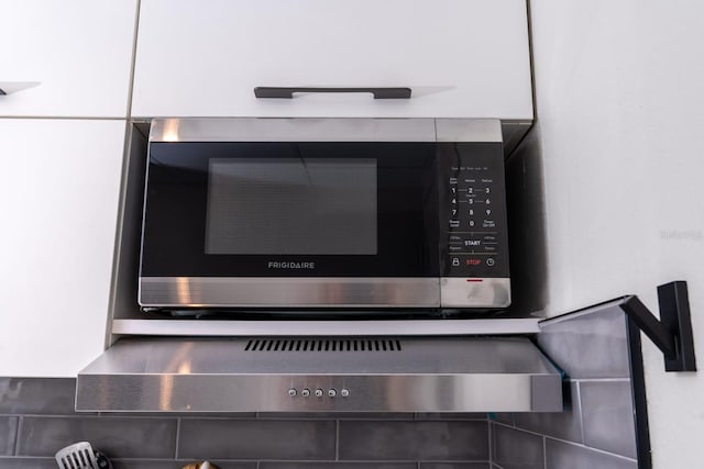 room details with stainless steel microwave