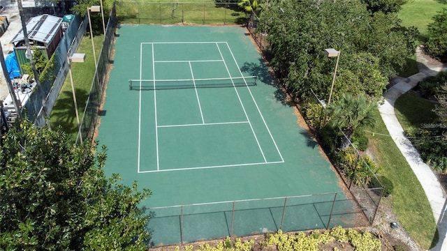 view of tennis court with fence