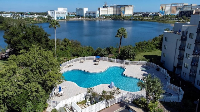 birds eye view of property featuring a water view and a city view