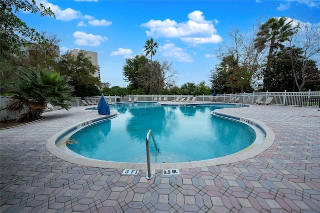 pool featuring a patio and fence