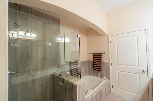 bathroom featuring separate shower and tub and tile patterned floors