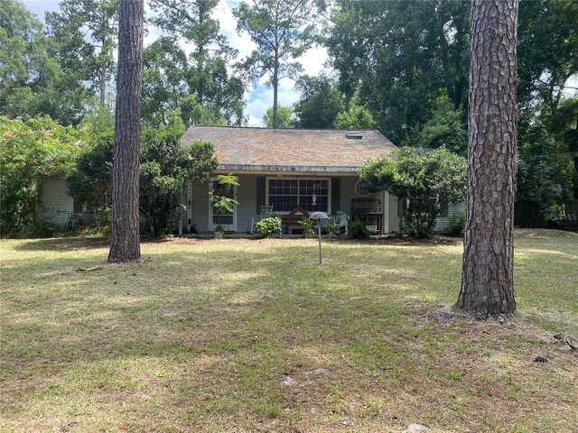 view of front of property with a front lawn