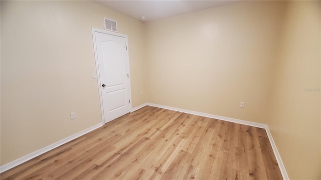 unfurnished room with light hardwood / wood-style floors