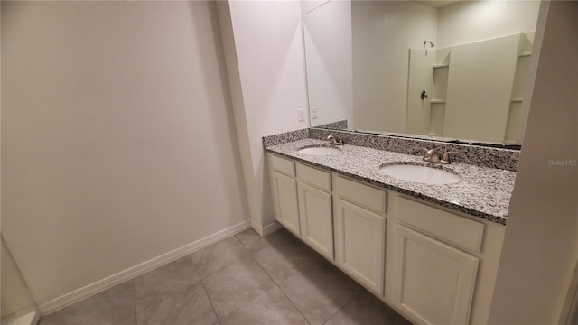 bathroom featuring tile patterned floors and vanity