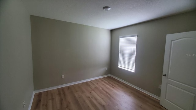 empty room with light wood-type flooring