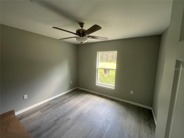 unfurnished room with ceiling fan and wood-type flooring