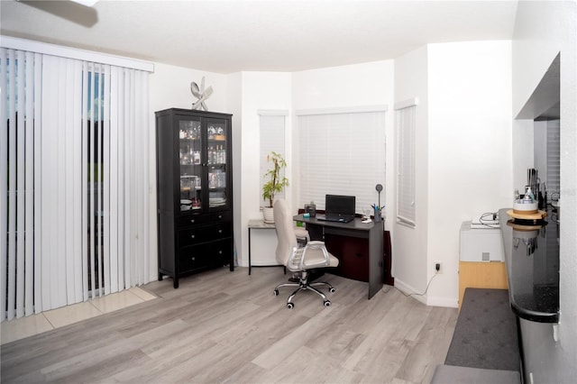 office area with light wood-type flooring