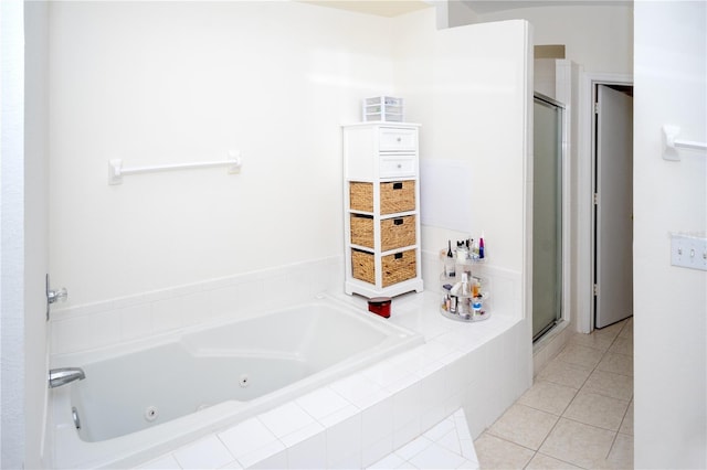 bathroom featuring shower with separate bathtub and tile patterned floors