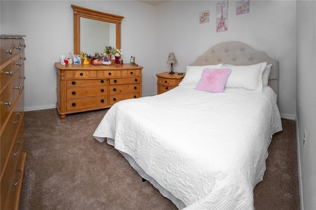 bedroom featuring dark carpet