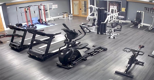 workout area with hardwood / wood-style flooring