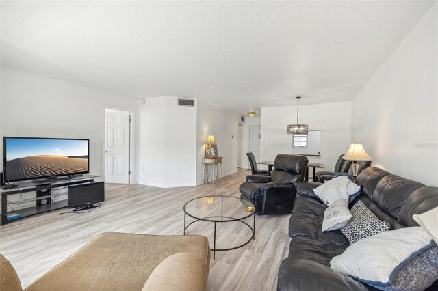 living room with light hardwood / wood-style flooring