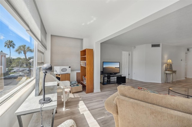 living room with light hardwood / wood-style floors