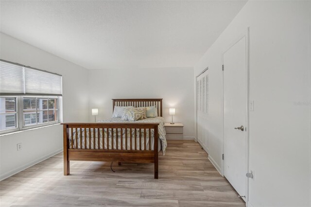 bedroom with light hardwood / wood-style floors