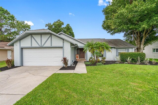 view of front of home with a garage and a front yard