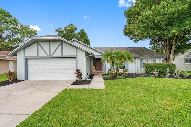 view of front of home featuring a front yard and a garage