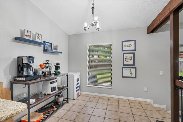 interior space with a notable chandelier and light tile patterned floors