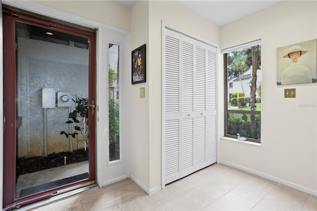 entrance foyer featuring light tile patterned flooring