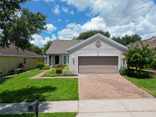 single story home with a front lawn and a garage