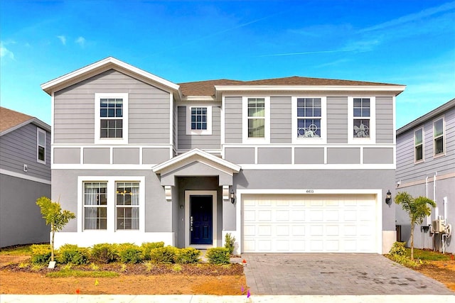 view of front of property featuring a garage