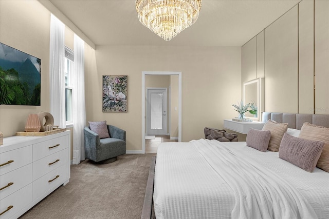 bedroom with light colored carpet and an inviting chandelier