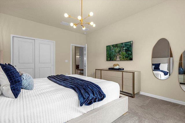 carpeted bedroom featuring a closet and a notable chandelier