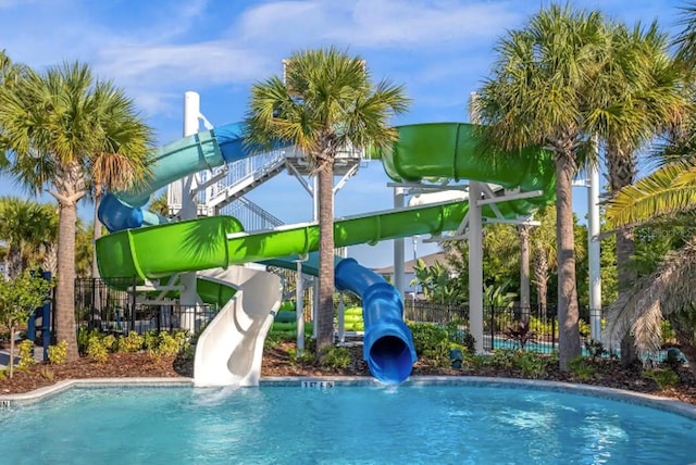 view of pool with a water slide