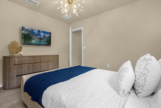 carpeted bedroom with a notable chandelier