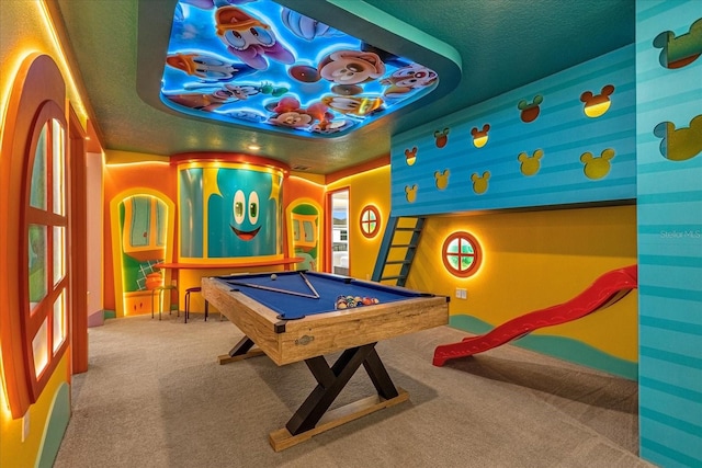 playroom with pool table, carpet floors, and a tray ceiling