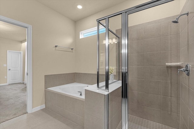 bathroom with plus walk in shower and tile patterned floors