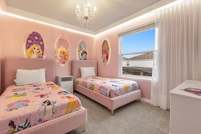 bedroom with a notable chandelier and carpet floors