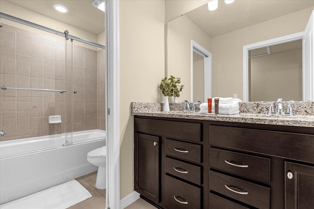 full bathroom with dual vanity, combined bath / shower with glass door, tile patterned flooring, and toilet