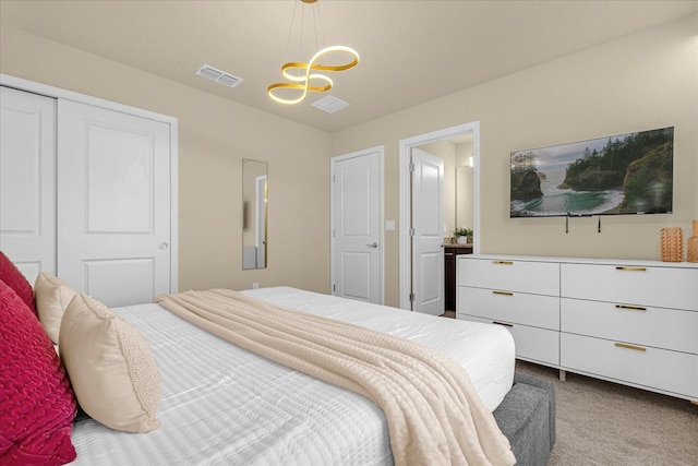 carpeted bedroom featuring a closet