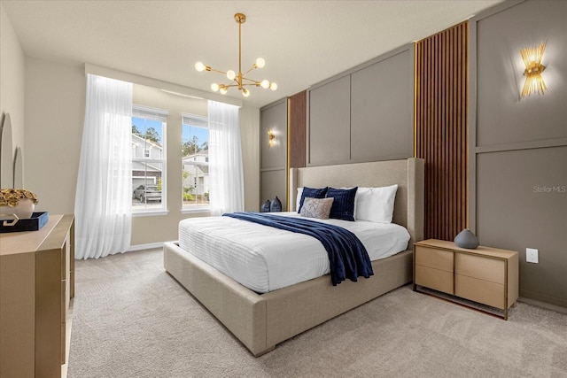 bedroom with an inviting chandelier and light colored carpet