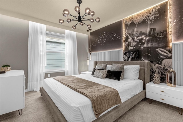 bedroom with carpet and an inviting chandelier