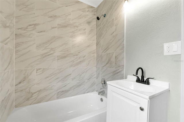 bathroom with vanity and tiled shower / bath combo