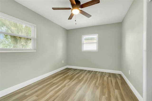 empty room featuring ceiling fan and light hardwood / wood-style floors