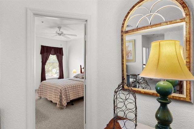 carpeted bedroom with ceiling fan