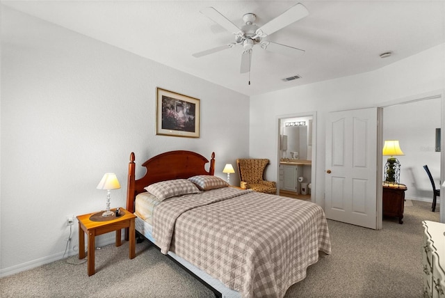 bedroom featuring ceiling fan, ensuite bath, and carpet floors