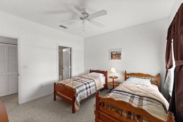 bedroom featuring a closet, ceiling fan, and carpet