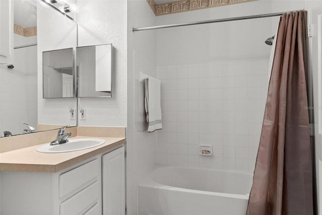 bathroom featuring vanity and shower / tub combo with curtain