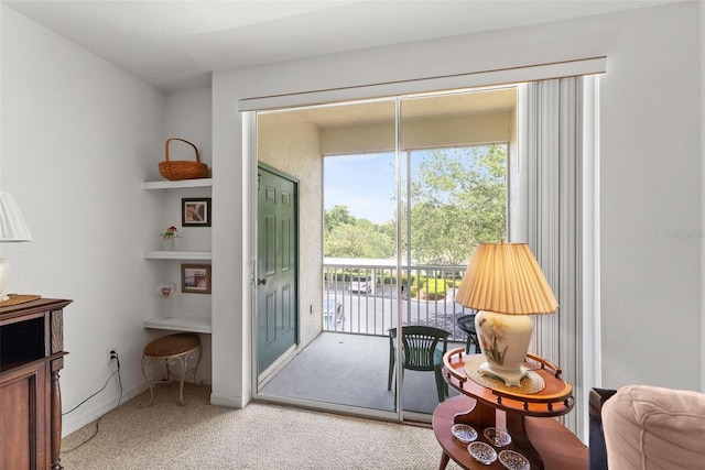 entryway with light colored carpet