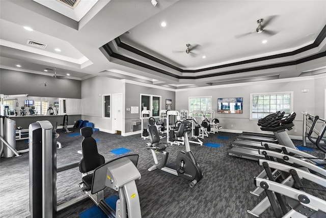 gym with crown molding, ceiling fan, and carpet floors