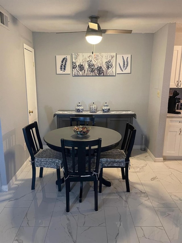 dining area featuring light tile patterned flooring and ceiling fan