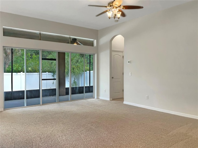 unfurnished room with carpet and ceiling fan